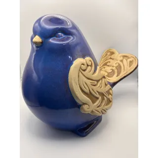 Photo of Large Ceramic Blue Bird Figurine with Intricate Scroll Work on Wings