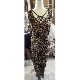 Photo of Leopard Long Dress Sleeveless With Great Criss Cross Black Design Across Chest.
