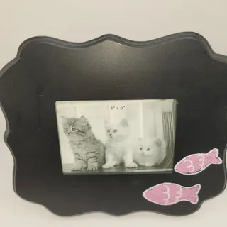 Photo of Black decorative frame featuring playful pink fish accents 4”x6” Photo