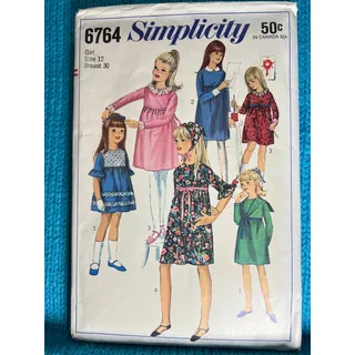 Photo of Simplicity 6764 pattern girls dress fit and flare ruffle sleeve 1960s size 14