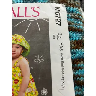 Photo of McCalls 6727 Sewing pattern infant reversible top dress shorts hat size Nb S M L XL