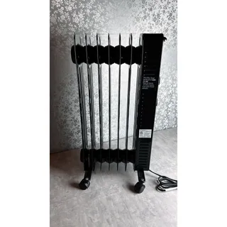 Photo of Mainstays 1500W Electric Oil-Filled Portable Radiant Space Heater + Safety Guard