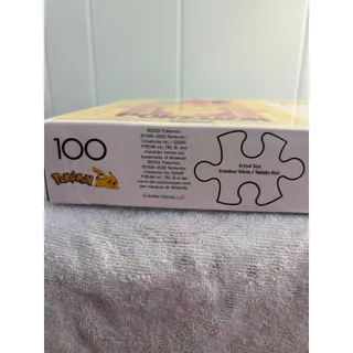 Photo of Buffalo Games 100-piece Pokemon "Sweet on You" jigsaw puzzle with eevee