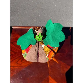 Photo of Vintage handmade fabric pumpkin decoration autumn-themed green leaves brown stem