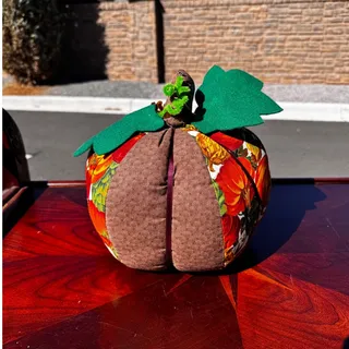 Photo of Vintage handmade fabric pumpkin decoration autumn-themed green leaves brown stem