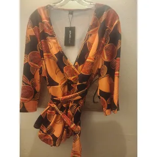 Photo of Orange faux-leather 4x skirt and printed top 3x