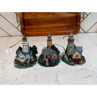 Photo of Thomas Kinkade Lighthouse Collection miniature illuminated lighthouse ornaments