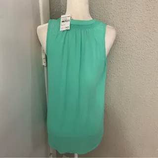 Photo of Bellatrix Tie Front Sleeveless S Corporate Siren Casual Dopamine Coconut Girl