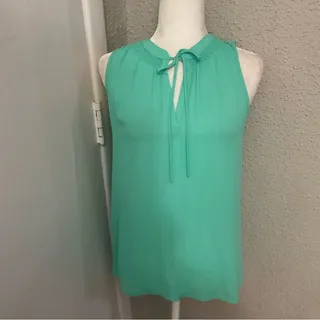 Photo of Bellatrix Tie Front Sleeveless S Corporate Siren Casual Dopamine Coconut Girl